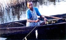 A person standing on a boat in the water

Description automatically generated