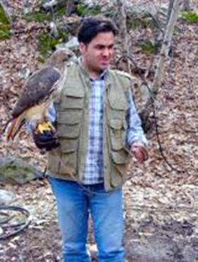 A person holding a bird on his arm

AI-generated content may be incorrect.